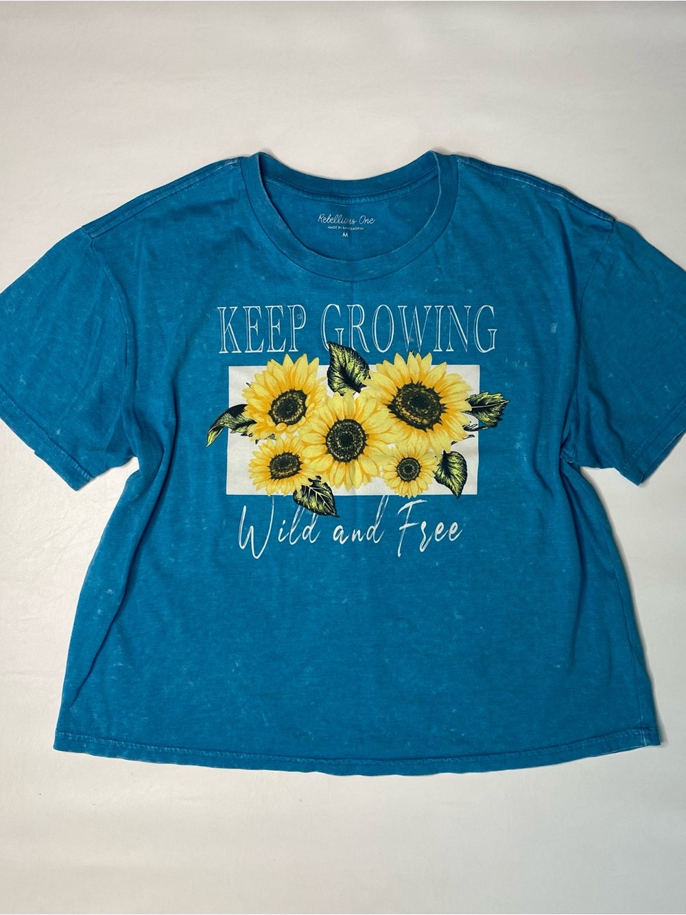 Rebellious One Bright Blue Crop Tee with Yellow Sunflower Graphic
